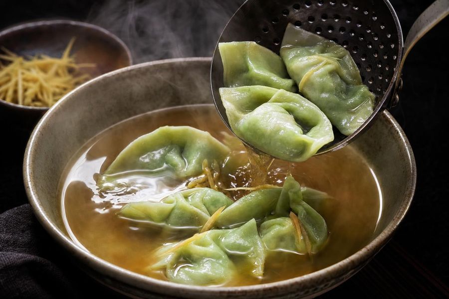 Edamame dumplings in broth