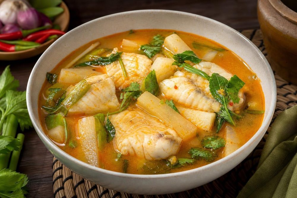 Kaeng Som Pla Sour Fish Curry, plated and ready to serve