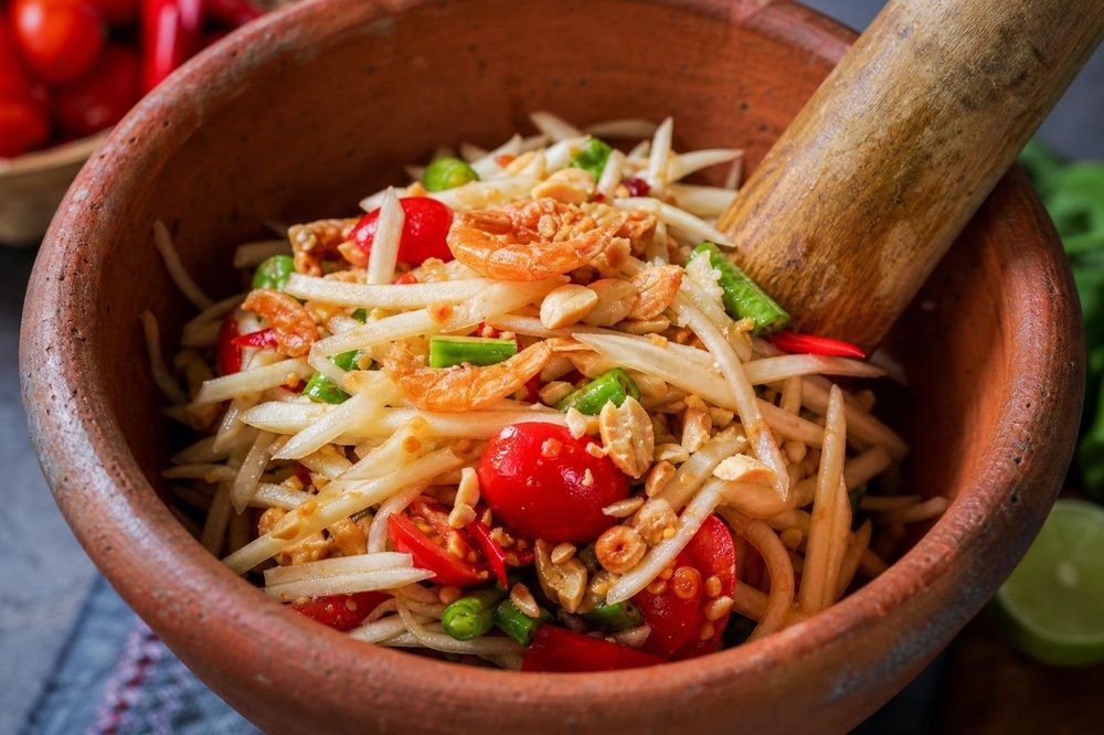 Jicama Som Tam Green Papaya Style Salad, plated and ready to serve