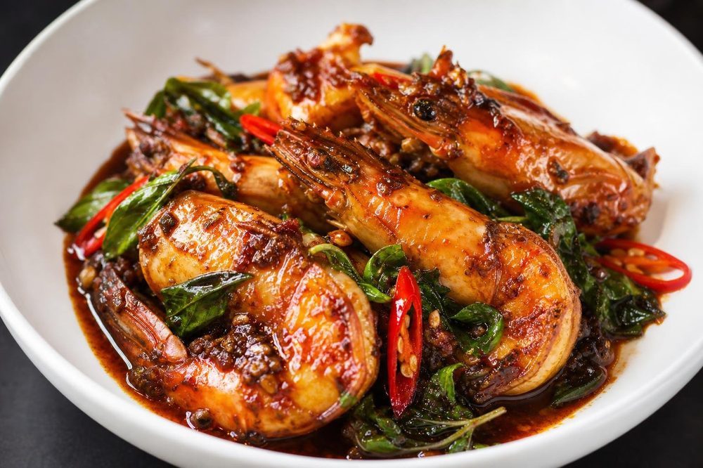 Goong Pad Nam Prik Pao Chili Paste Prawns, plated and ready to serve