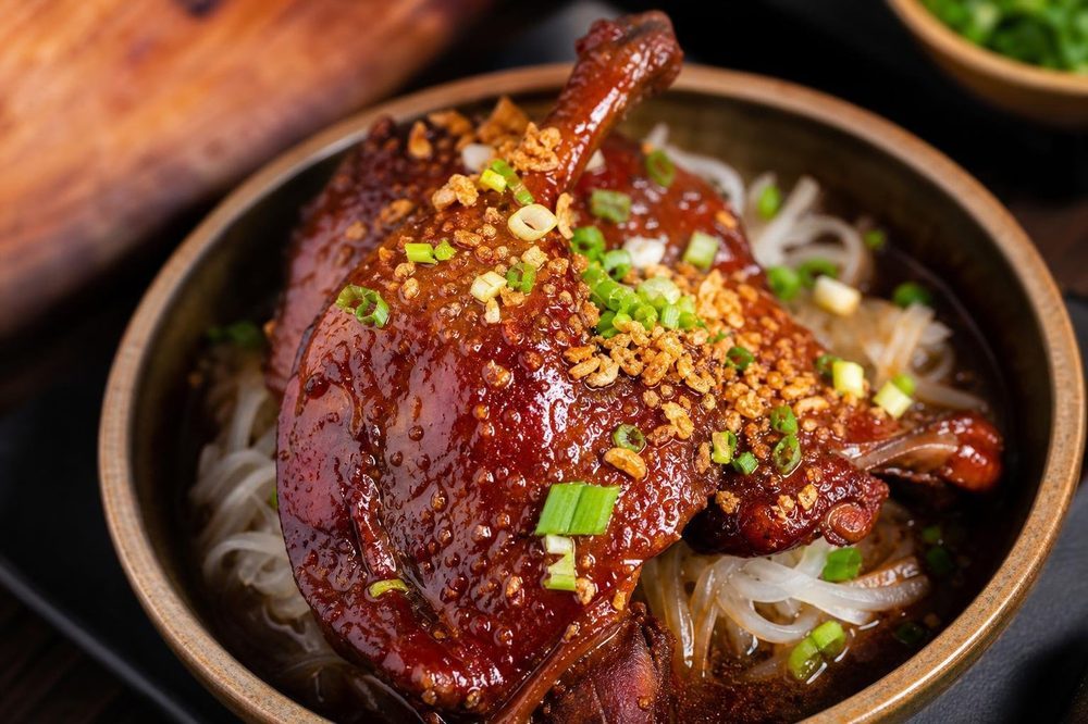 Ped Daeng Red Braised Duck, plated and ready to serve
