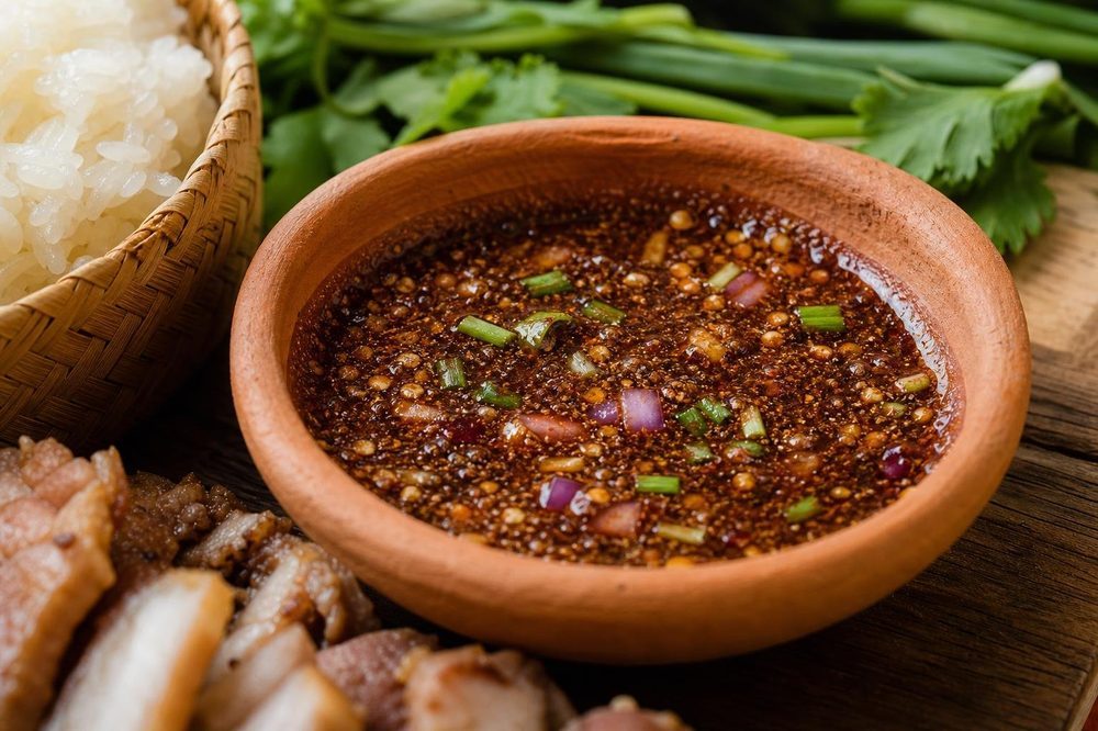 Nam Jim Jaew Isan Tamarind Dipping Sauce, plated and ready to serve