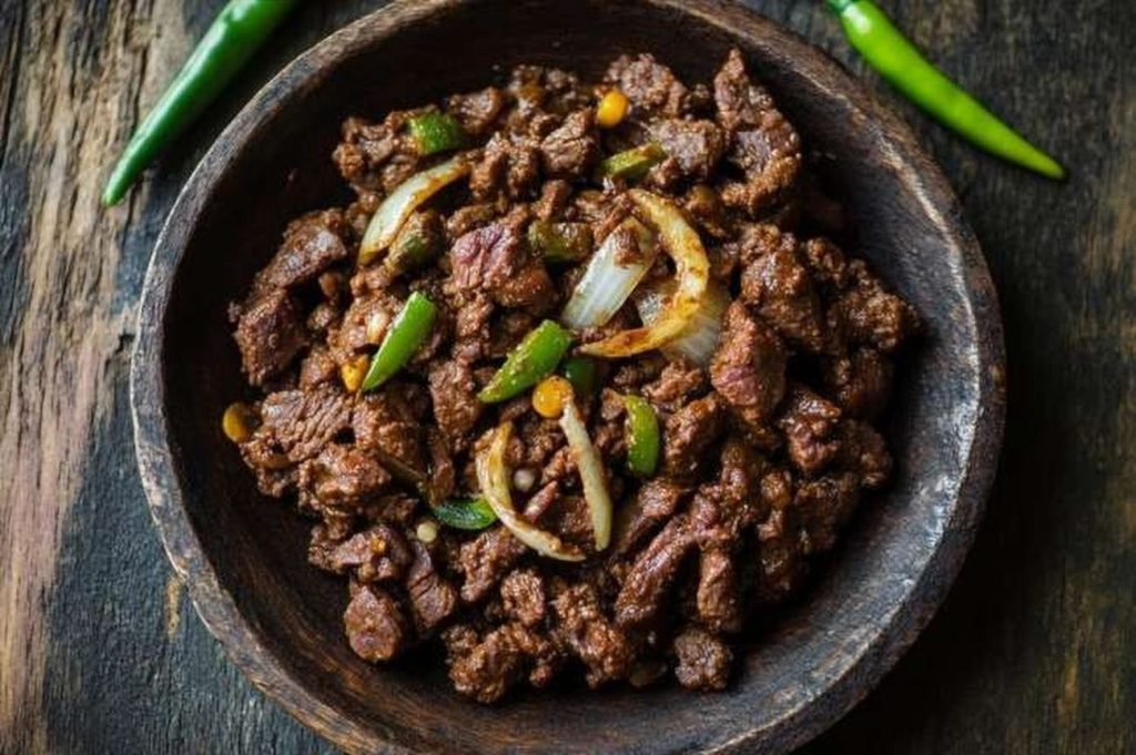 Ethiopian Beef Dulet, Minced & Sautéed with Herb Butter, plated and ready to serve