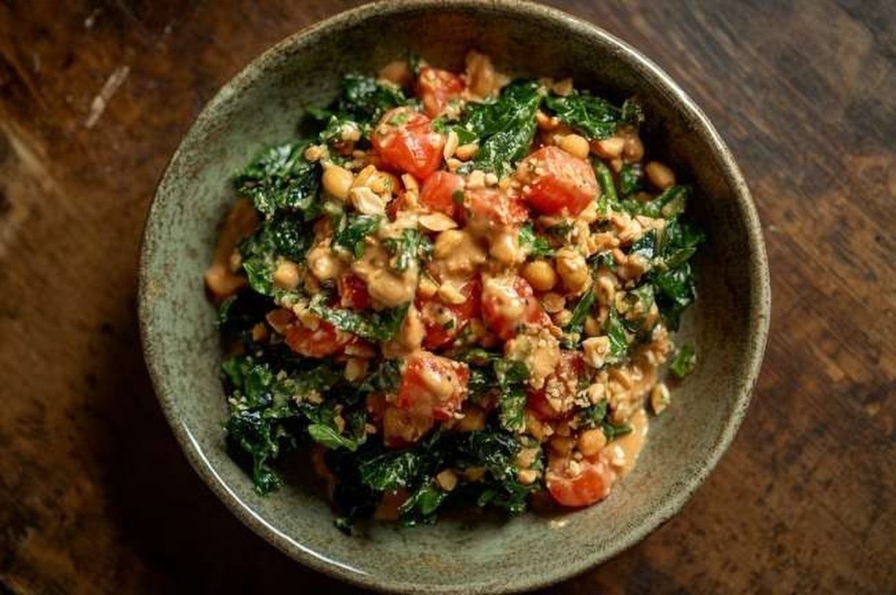 Ugandan Groundnut & Greens Salad, plated and ready to serve